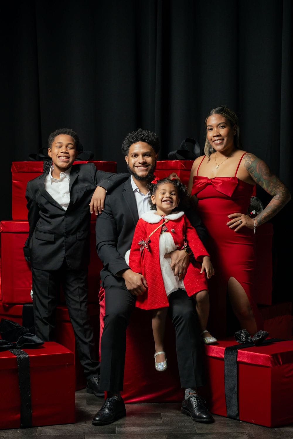 Family holiday photo session on a themed red and black backdrop by Create With Amy in Harford County, Maryland