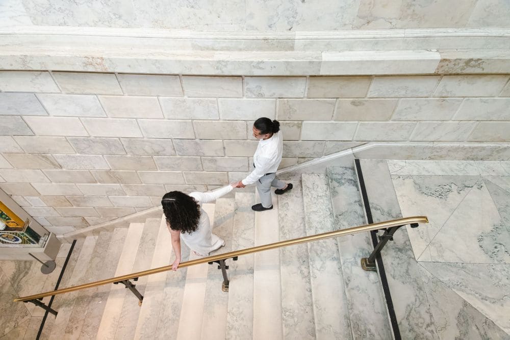 Engagement session on a marble staircase photographed by Create With Amy, proposal photographer for Maryland couples
